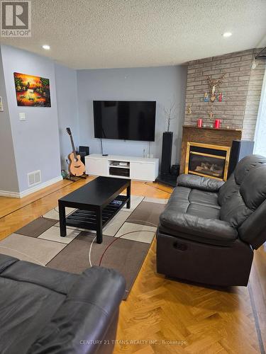 41 - 1051 Cedarglen Gate, Mississauga, ON - Indoor Photo Showing Living Room With Fireplace