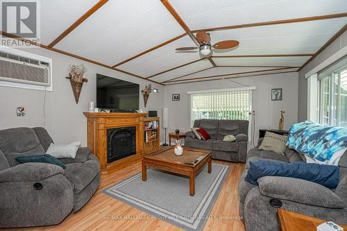 47 - 5216 County Road 90, Springwater, ON - Indoor Photo Showing Living Room With Fireplace