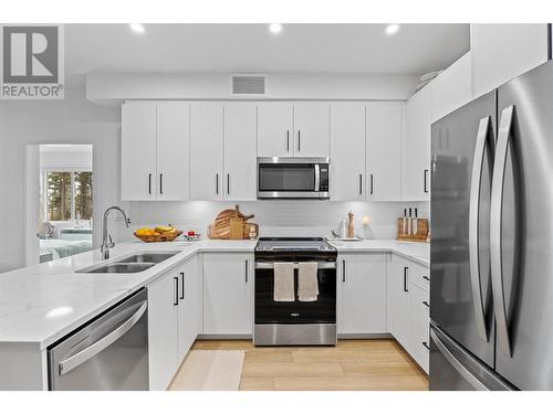 3434 Mckinley Beach Drive Unit# 109, Kelowna, BC - Indoor Photo Showing Kitchen With Double Sink With Upgraded Kitchen