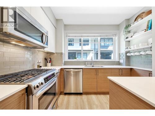 304 2135 Heritage Park Lane, North Vancouver, BC - Indoor Photo Showing Kitchen With Double Sink With Upgraded Kitchen