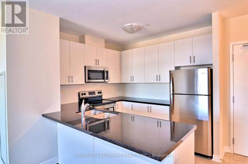 619 - 7325 Markham Road, Markham (Cedarwood), ON - Indoor Photo Showing Kitchen With Double Sink With Upgraded Kitchen