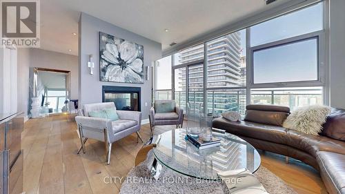 Uph4103 - 33 Shore Breeze Drive, Toronto W06, ON - Indoor Photo Showing Living Room With Fireplace