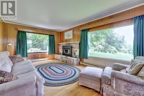 2022 Valens Road N, Hamilton, ON - Indoor Photo Showing Living Room With Fireplace