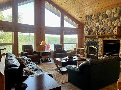 59 Poplar Bay, Kenora, ON - Indoor Photo Showing Living Room With Fireplace