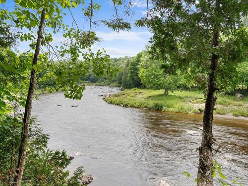 Vue sur l'eau - 21 Rue Du Rocher-Fleuri, Saint-Raphaël, QC - Outdoor With Body Of Water With View