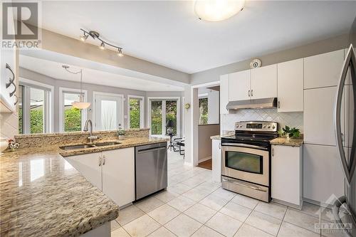 Terrific storage and space in this bright kitchen - 5 Springwood Circle, Ottawa, ON - Indoor Photo Showing Kitchen With Double Sink