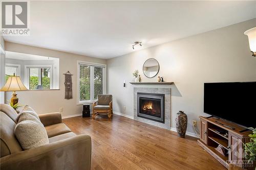 Comfortable den with gorgeous gas fireplace, replaced just last year - 5 Springwood Circle, Ottawa, ON - Indoor Photo Showing Living Room With Fireplace