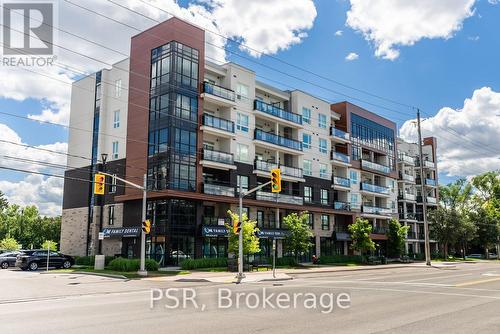 211 - 320 Plains Road E, Burlington, ON - Outdoor With Balcony With Facade