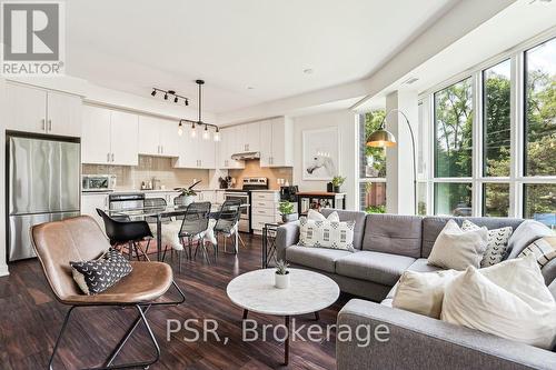 211 - 320 Plains Road E, Burlington, ON - Indoor Photo Showing Living Room