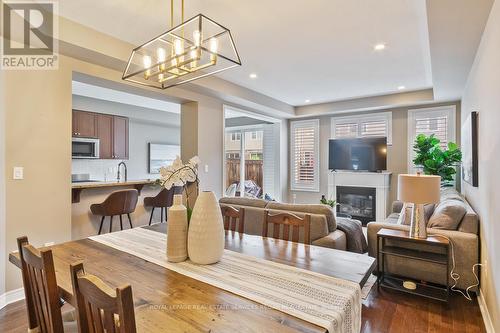 44 - 2019 Trawden Way, Oakville, ON - Indoor Photo Showing Dining Room With Fireplace
