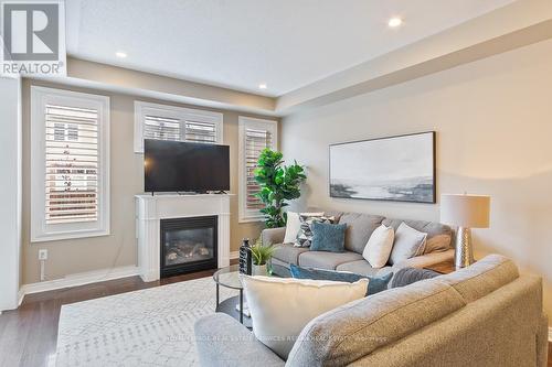 44 - 2019 Trawden Way, Oakville, ON - Indoor Photo Showing Living Room With Fireplace