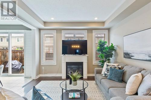44 - 2019 Trawden Way, Oakville, ON - Indoor Photo Showing Living Room With Fireplace