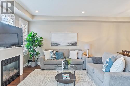 44 - 2019 Trawden Way, Oakville, ON - Indoor Photo Showing Living Room With Fireplace