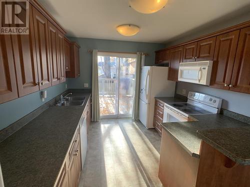 B 4609 Boundary Road, Fort Nelson, BC - Indoor Photo Showing Kitchen With Double Sink