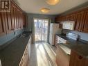 B 4609 Boundary Road, Fort Nelson, BC  - Indoor Photo Showing Kitchen With Double Sink 