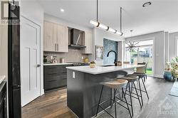 super kitchen with signature pantry at left. This again is the model home so finishing choices and colours will vary.  Appliances and accessories not included in actual listed property. - 