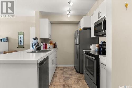 1205 5500 Mitchinson Way, Regina, SK - Indoor Photo Showing Kitchen With Double Sink