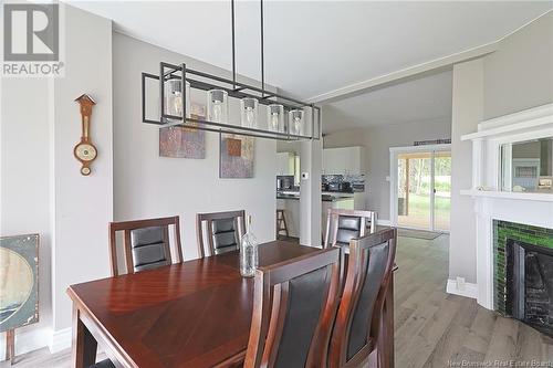 8 Mott Road, Waterborough, NB - Indoor Photo Showing Dining Room With Fireplace