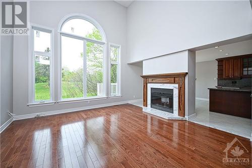 Family with Fireplace - 38 Knudson Drive, Ottawa, ON - Indoor Photo Showing Living Room With Fireplace