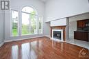 Family with Fireplace - 38 Knudson Drive, Ottawa, ON  - Indoor Photo Showing Living Room With Fireplace 