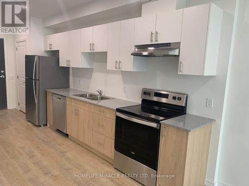 516 - 181 Elmira Road S, Guelph (West Willow Woods), ON - Indoor Photo Showing Kitchen With Stainless Steel Kitchen With Double Sink