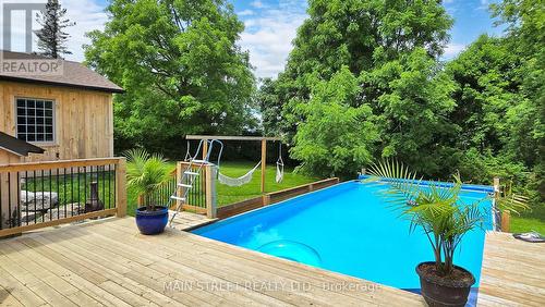 126 King Street, Kawartha Lakes (Woodville), ON - Outdoor With Above Ground Pool With Deck Patio Veranda