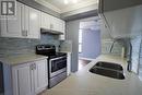 1604 - 3170 Kirwin Avenue, Mississauga, ON  - Indoor Photo Showing Kitchen With Stainless Steel Kitchen With Double Sink 