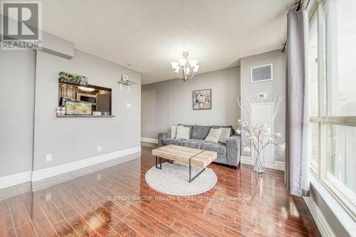 307 - 2901 Kipling Avenue, Toronto (Mount Olive-Silverstone-Jamestown), ON - Indoor Photo Showing Living Room With Fireplace