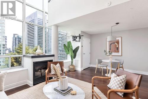 703 - 250 Manitoba Street, Toronto, ON - Indoor Photo Showing Living Room With Fireplace