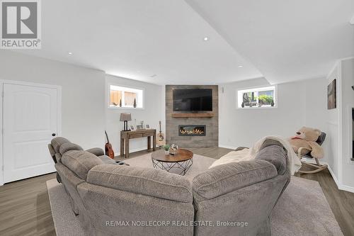 80 Allegra Drive, Wasaga Beach, ON - Indoor Photo Showing Living Room With Fireplace