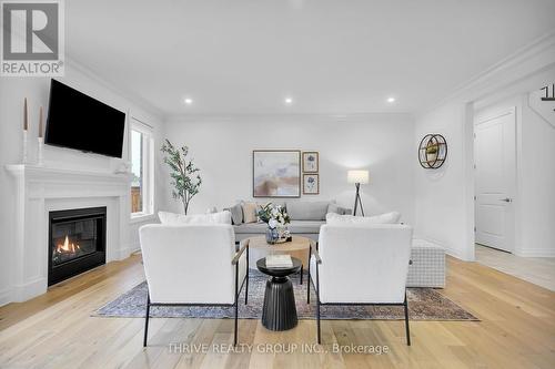 1345 Silverfox Drive, London, ON - Indoor Photo Showing Living Room With Fireplace