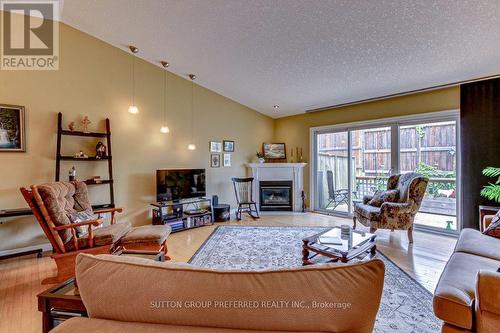 14 - 572 Thistlewood Drive, London, ON - Indoor Photo Showing Living Room With Fireplace