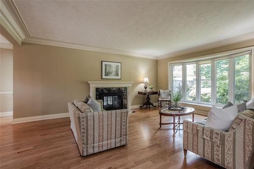 Double sided fireplace. - 674 Holt Drive, Burlington, ON - Indoor Photo Showing Living Room With Fireplace