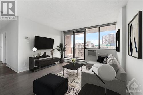 This photo has been virtually staged. - 154 Nelson Street Unit#902, Ottawa, ON - Indoor Photo Showing Living Room