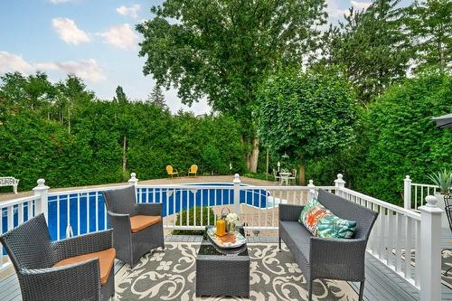 Large tiered Deck makes summer entertaining a breeze! - 2182 Maplewood Drive, Burlington, ON - Outdoor With In Ground Pool With Deck Patio Veranda