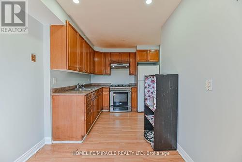 201 - 6444 Finch Avenue W, Toronto (Mount Olive-Silverstone-Jamestown), ON - Indoor Photo Showing Kitchen With Double Sink