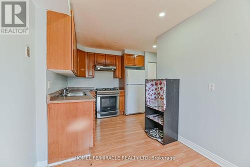 201 - 6444 Finch Avenue W, Toronto (Mount Olive-Silverstone-Jamestown), ON - Indoor Photo Showing Kitchen With Double Sink