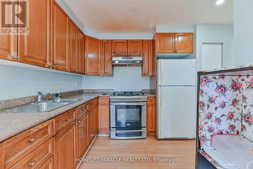 201 - 6444 Finch Avenue W, Toronto W10, ON - Indoor Photo Showing Kitchen With Double Sink