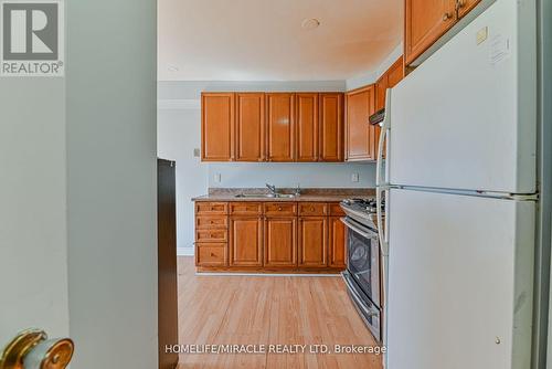 201 - 6444 Finch Avenue W, Toronto (Mount Olive-Silverstone-Jamestown), ON - Indoor Photo Showing Kitchen With Double Sink