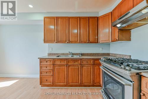 201 - 6444 Finch Avenue W, Toronto (Mount Olive-Silverstone-Jamestown), ON - Indoor Photo Showing Kitchen With Double Sink