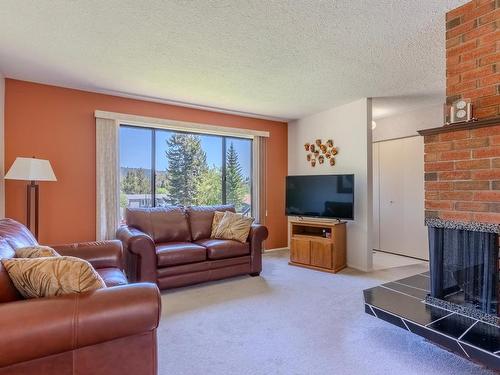 310 Cinnibar Crt, Logan Lake, BC - Indoor Photo Showing Living Room With Fireplace