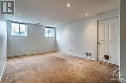 Fully finished basement with a rec room with pot lighting, storage, and laundry. - 