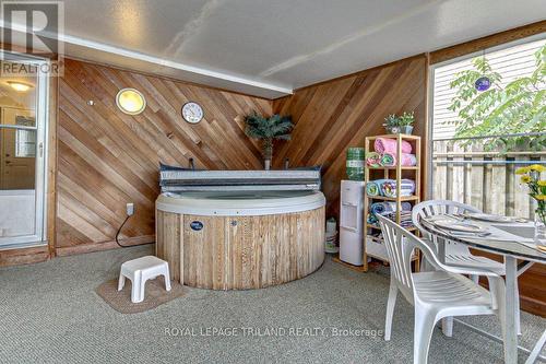 Sunroom with Hot Tub for Year Round Enjoyment - 33 Hillhead Road, London, ON - Indoor