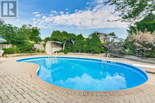 All Pool Equipment and Toys Included - 33 Hillhead Road, London, ON - Outdoor With In Ground Pool With Backyard