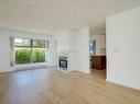 102-535 Manchester Rd, Victoria, BC  - Indoor Photo Showing Living Room With Fireplace 