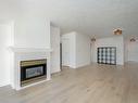 102-535 Manchester Rd, Victoria, BC  - Indoor Photo Showing Living Room With Fireplace 