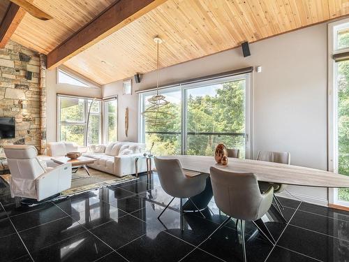 Overall view - 1042 Mtée De Bourgogne, Saint-Sauveur, QC - Indoor Photo Showing Dining Room With Fireplace