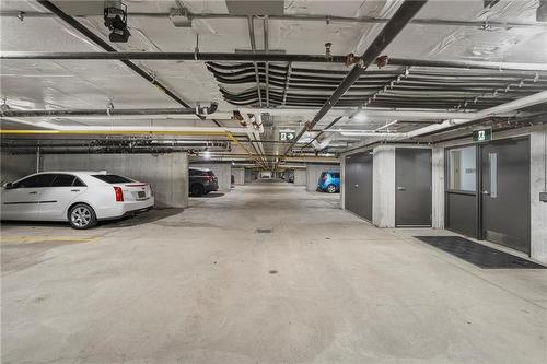 Parking spot with storage locker - 212 Lakeport Road|Unit #312, St. Catharines, ON - Indoor Photo Showing Garage