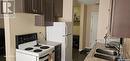 303 710 Melrose Avenue, Saskatoon, SK  - Indoor Photo Showing Kitchen With Double Sink 