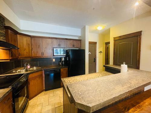 1116 - 7495 Columbia Avenue, Radium Hot Springs, BC - Indoor Photo Showing Kitchen With Double Sink